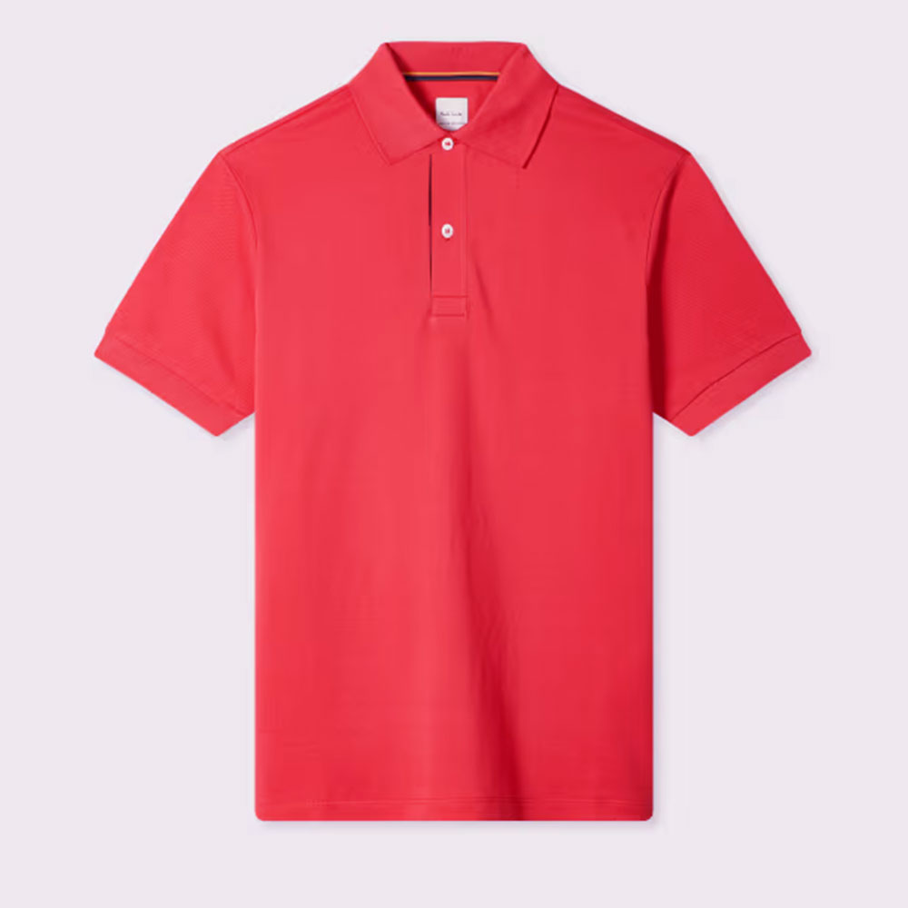 El polo Paul Smith Coral Pink 'Artist Stripe' Placket representa una visión moderna del clásico polo masculino.